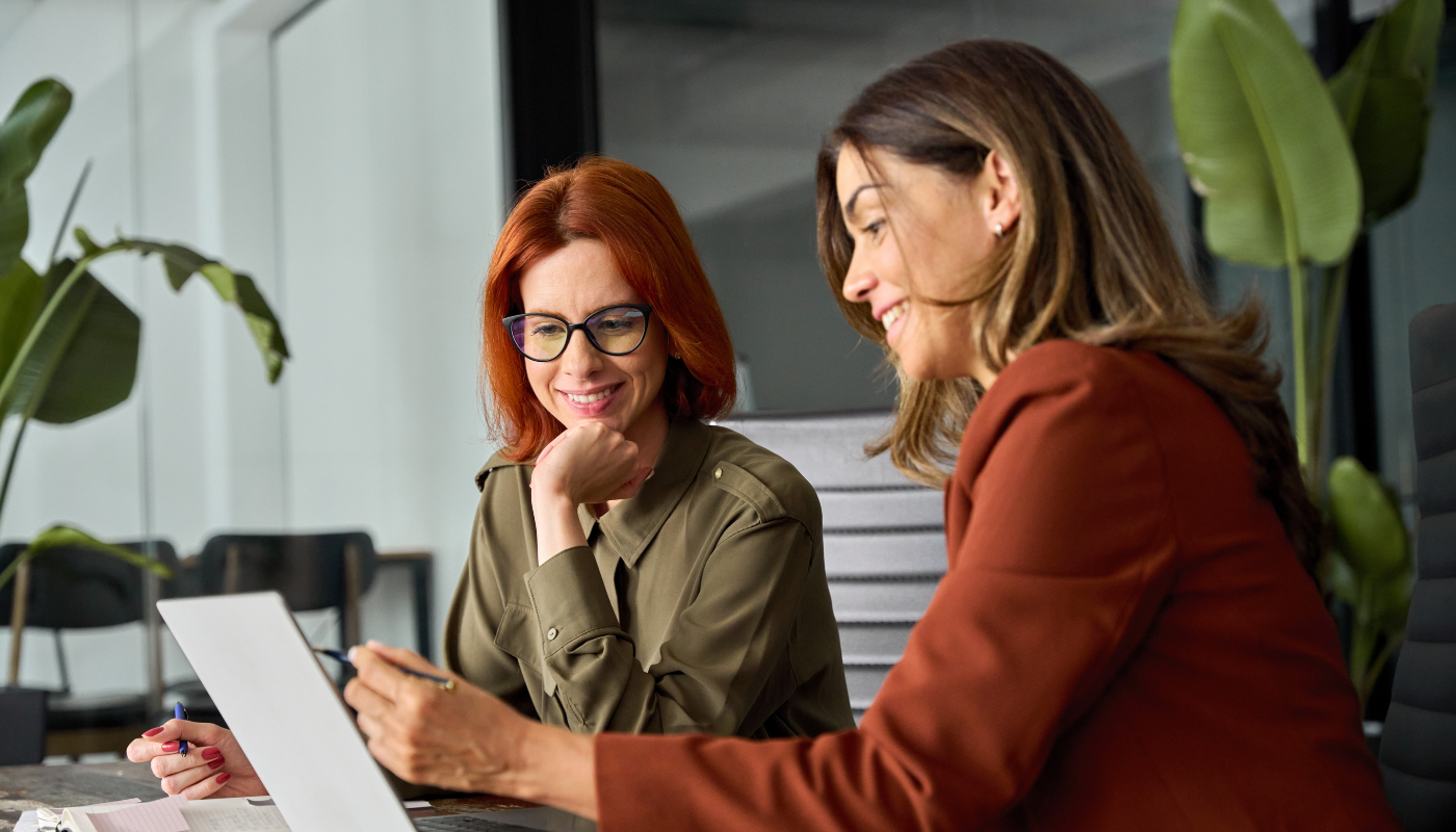 two women on B2 Collab's marketing team working together