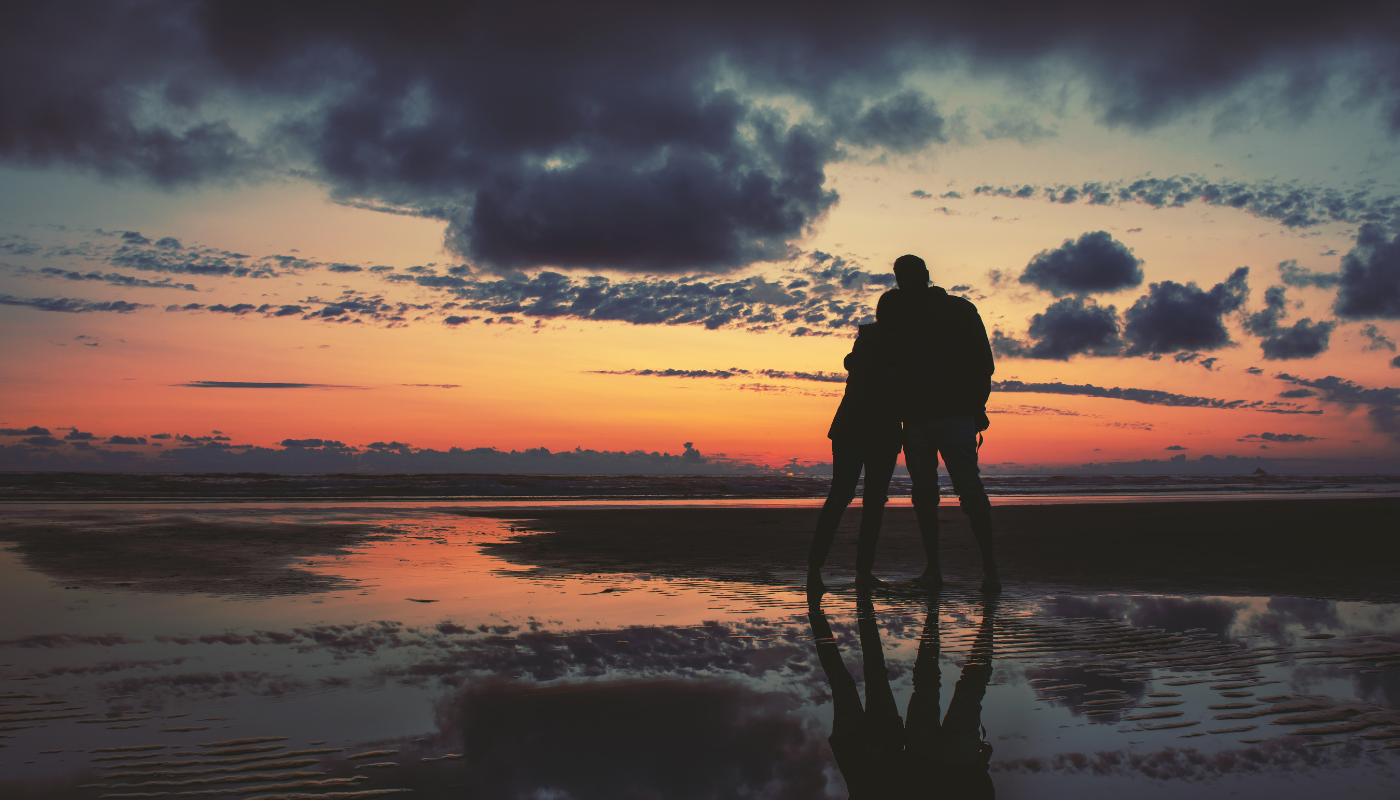 couple on the beach at sunset