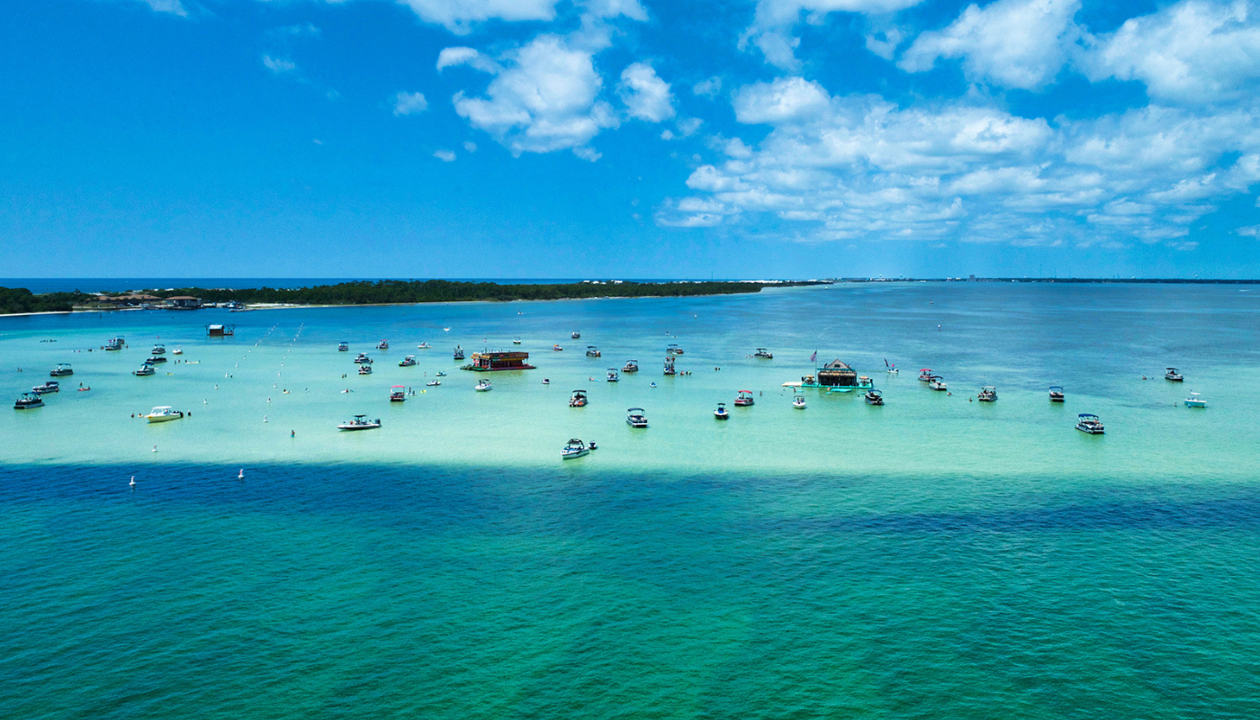 photo of boats on water at crab island