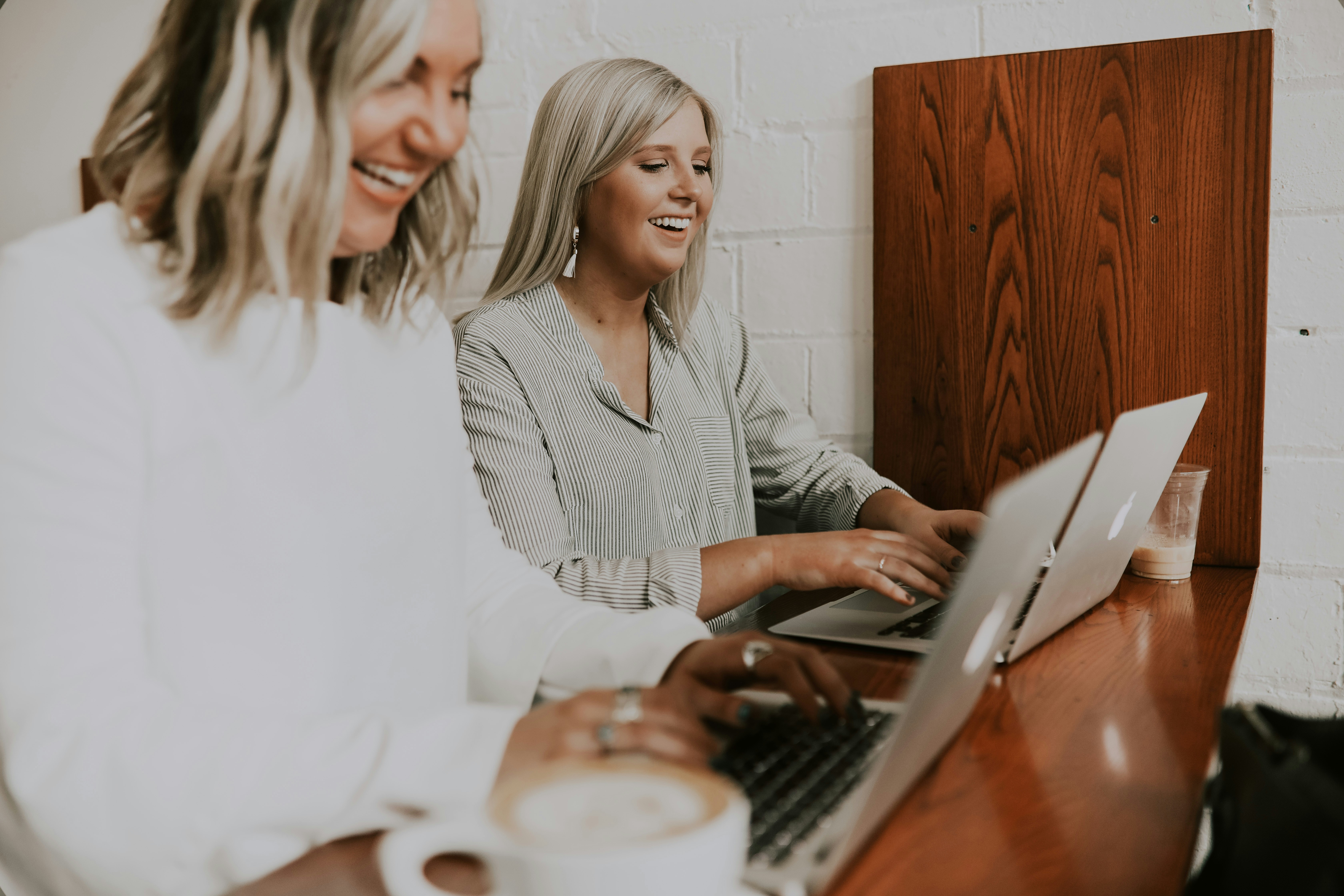 two professional young women working on their computers