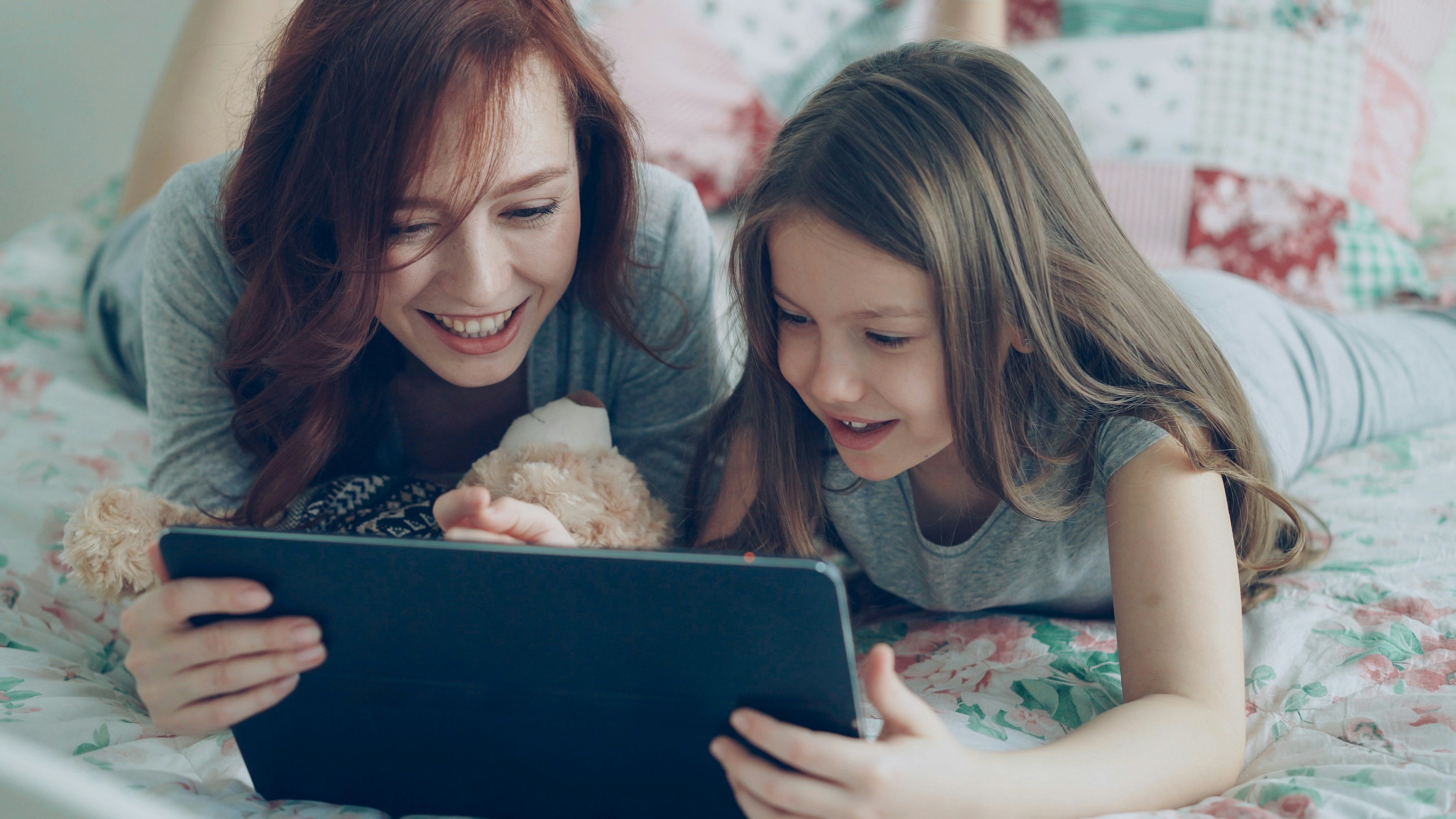 Mom and daughter looking at a vacation rental website